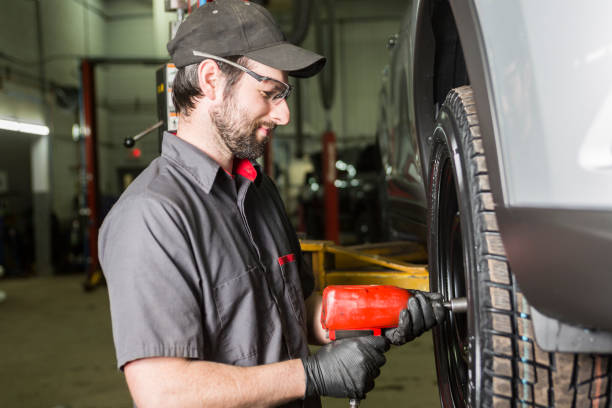 istock Mechanic working on car in his shop 854441432