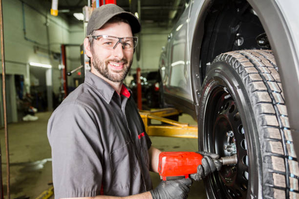 istock Mechanic working on car in his shop 854441564