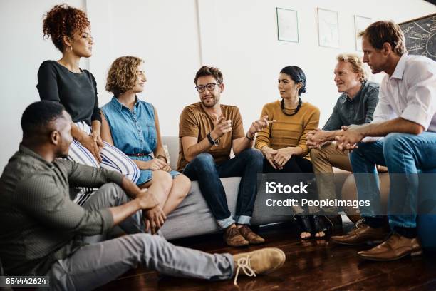 They Boast A Dynamic Range Of Talents Stock Photo - Download Image Now - Group Of People, Discussion, Talking