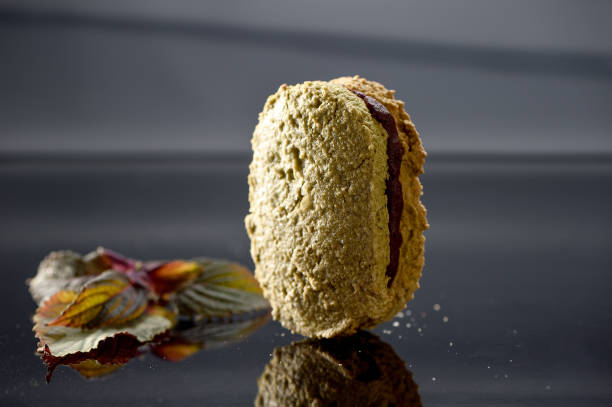istock Famous dessert cake matcha dacquoise (French pronunciation) on reflective black background 854445664