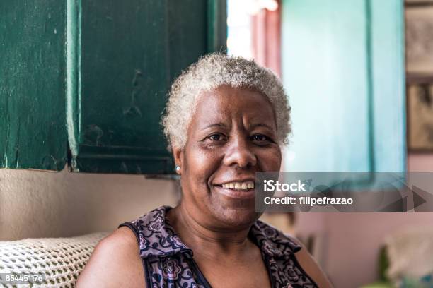 Afro Brazilian Woman Smiling At Home Stock Photo - Download Image Now - One Woman Only, Women, African Ethnicity