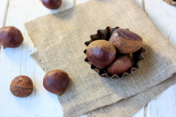 istock Heap of fresh chestnuts 854451212