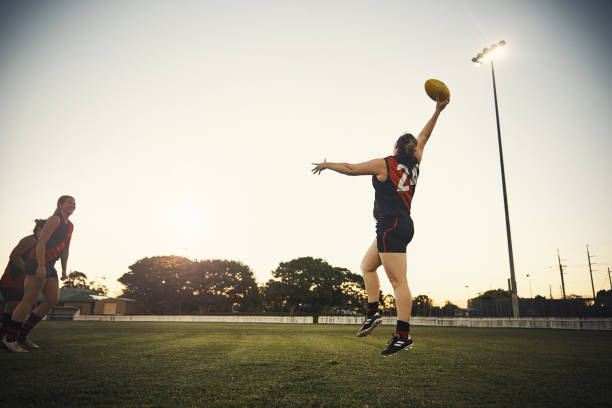 What a catch! Shot of a team of woman playing a game of football club soccer photos stock pictures, royalty-free photos & images