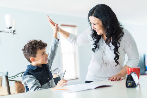 istock Mother Helping Son for the Homework at home 854462024