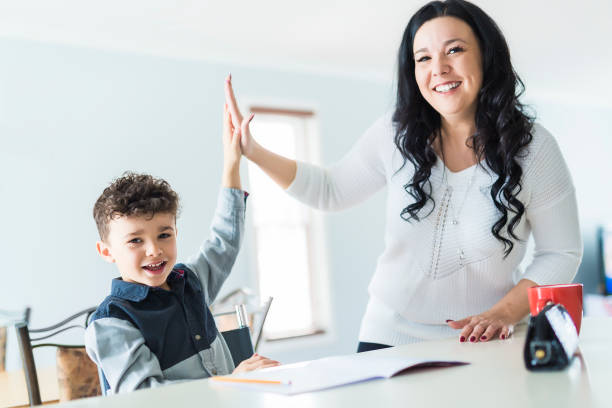 istock Mother Helping Son for the Homework at home 854462120