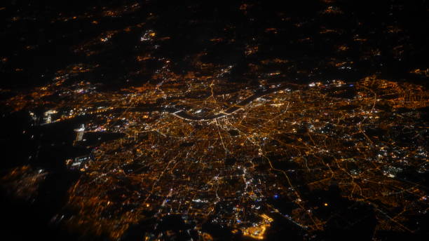 istock light of bets at night through the window of a plane 854462700