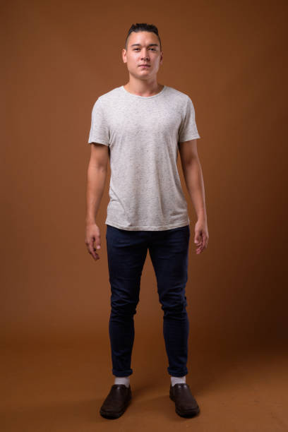 istock Studio shot of young handsome multi-ethnic man against colored background 854465334