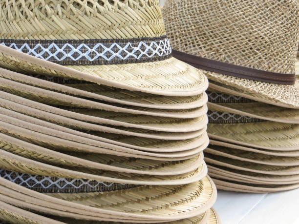 istock lots of straw hats 854467658