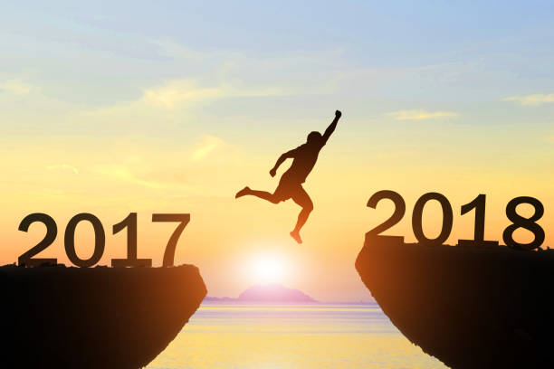 istock Men jump new year 2017 to 2018 854473044