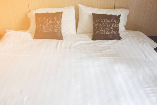 istock Bed in hotel, close-up bed,Close-up Made bedding sheets and pillow 854473620