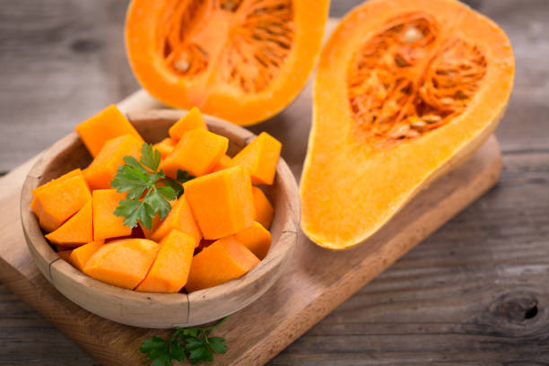 istock Butternut squash on the wooden table 854474330