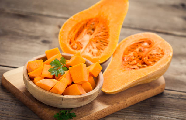 istock Butternut squash on the wooden table 854474500