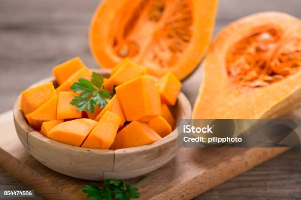 Butternut Squash On The Wooden Table Stock Photo - Download Image Now - Butternut Squash, Pumpkin, Food