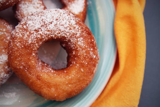 istock Donut breakfast and orange napkin. Desert. 854478784