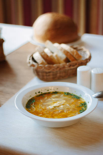 istock Soup at white ceramic plate at the table. 854479044