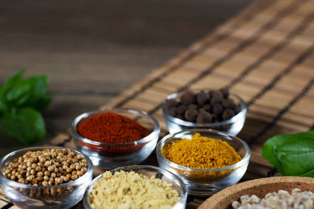 istock Various colorful spices on wooden table. Place for typography and logo 854479238