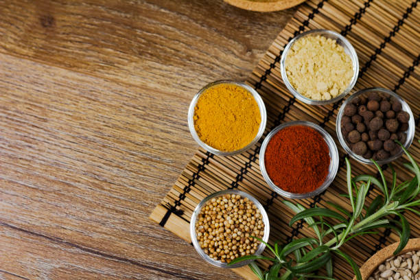 istock Various colorful spices on wooden table. Place for typography and logo 854479866