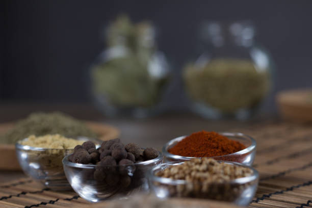Various colorful spices on wooden table. Place for typography and logo