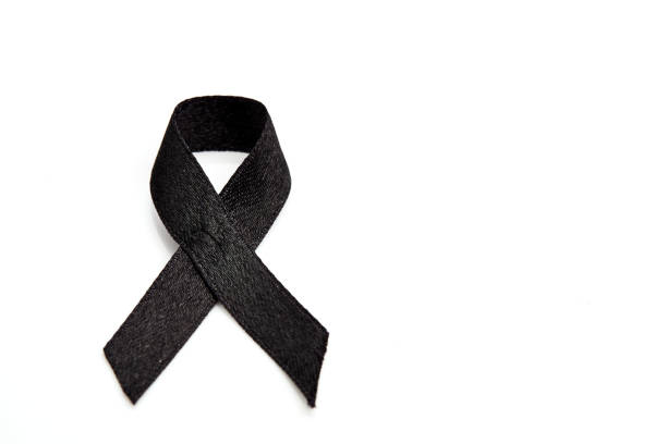 istock Black ribbon isolated on white 854480786