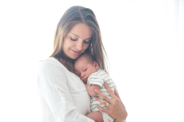 istock Young mother, holding her newborn baby boy 854481234