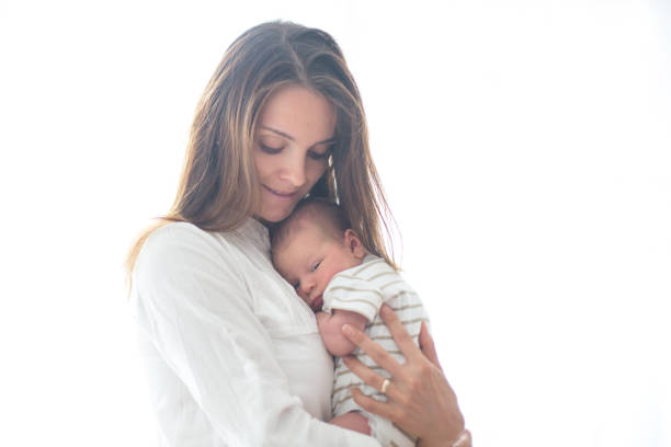 istock Young mother, holding her newborn baby boy 854484694
