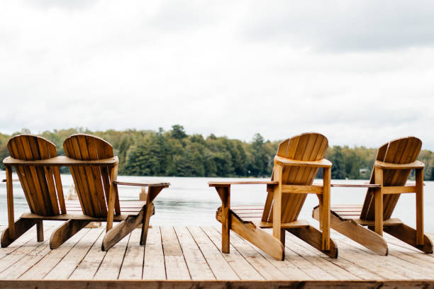 istock Adirondack Chairs at the end of a pier 854484730