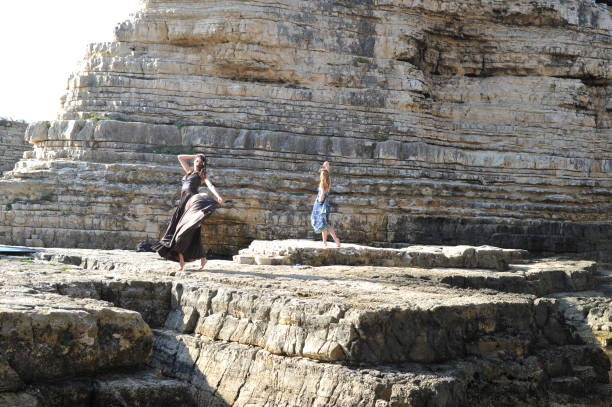istock Young Girls Posing Outside on Rocks 854485172
