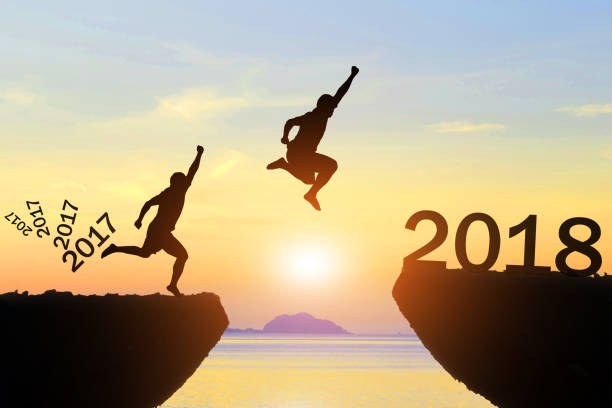 istock Men jump Happy New Year 2017 to 2018 854488002