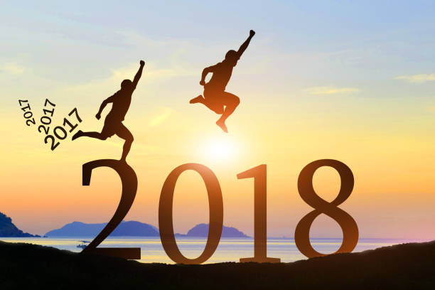 istock Men jump Happy New Year 2017 to 2018 854488196