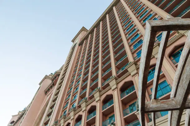 Photo of Atlantis hotel that look from below with blue sky background in Dubai.