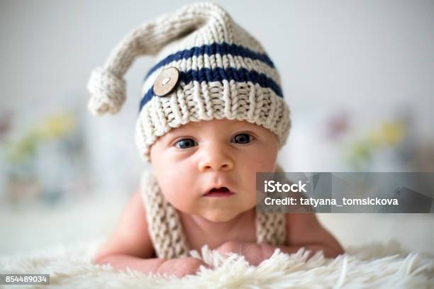 Little Newborn Baby Boy Looking Curiously At Camera Stock Photo - Download Image Now