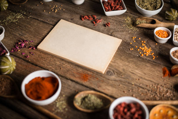 istock Variety of spices and herbs on kitchen table. 854489556