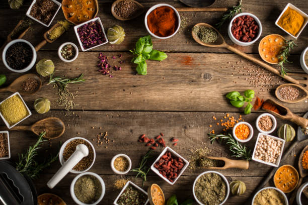 istock Variety of spices and herbs on kitchen table. 854489564