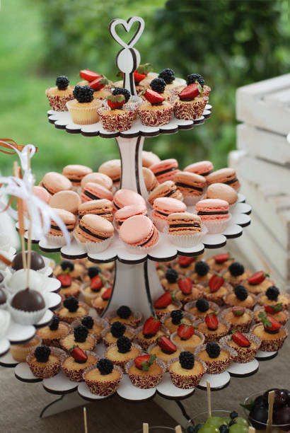 istock Delicious sweet buffet with cupcakes on shelf. Candy bar. 854489786