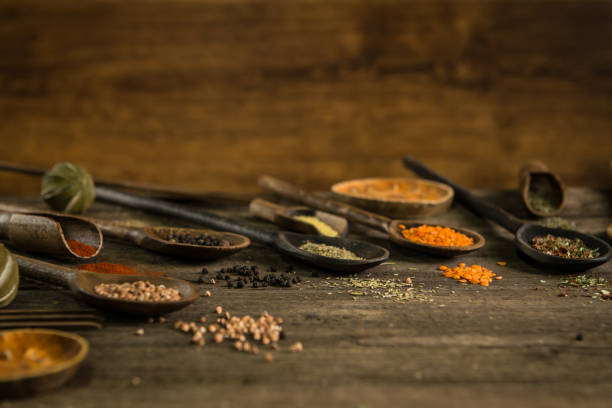 istock Variety of spices and herbs on kitchen table. 854490030
