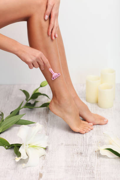 istock Woman is shaving her legs. 854495704
