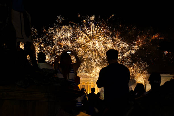 Philadelphia, PA USA - July 4, 2013; People watch the Fourth of July fireworks display over the Philadelphia Art Museum, in Philadelphia, PA.
