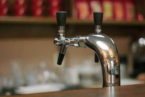 istock Metal beer tap on the bar whith the black handle. 854498900