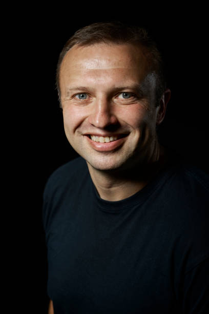 istock dark portrait of a young man 854499338