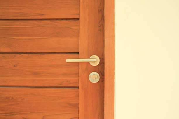 istock Modren style door handle on wooden door 854499344