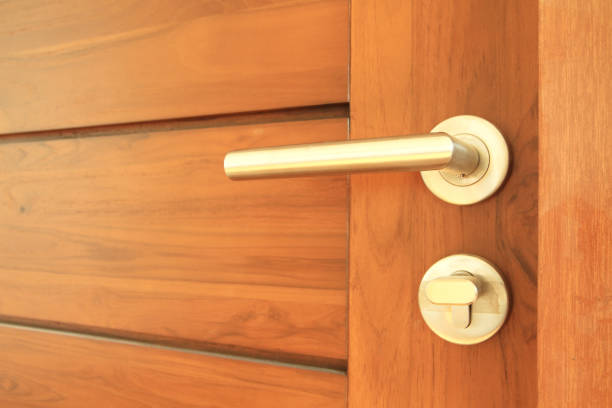 istock Modren style door handle on wooden door 854499350