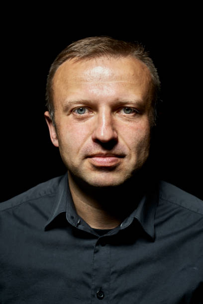 istock dark portrait of a young man 854499404
