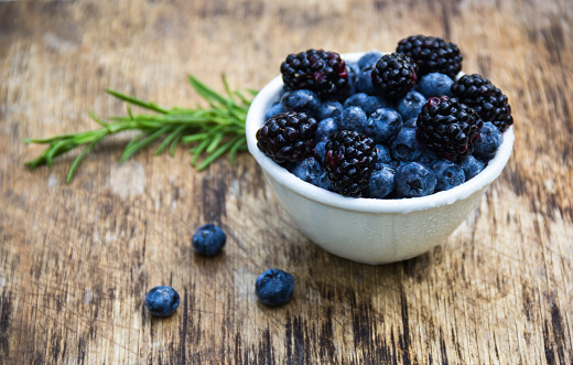 Juicy berries of blueberries and blackberries. Natural sweets. Useful berries.