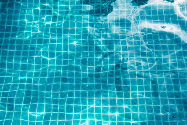 istock surface of transparent swimming pool water 854514844