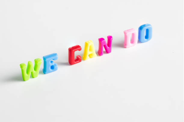 istock text WE CAN DO colorful word on white background 854524292