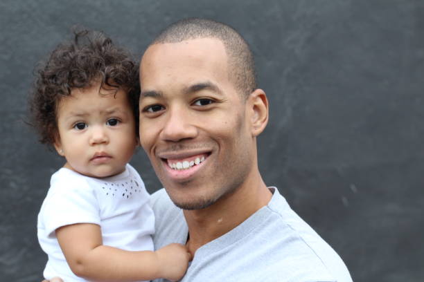 Father holding his cute little daughter Father holding his cute little daughter. puerto rican ethnicity stock pictures, royalty-free photos & images