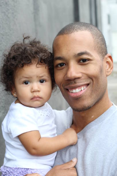 istock Black father and cute little daughter embracing 854524928