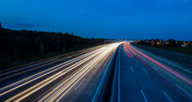 istock light trace from busy night traffic on the highway 854528368
