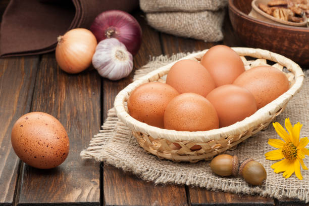 istock chicken eggs in basket decorated with food ingredients on wooden table 854528566