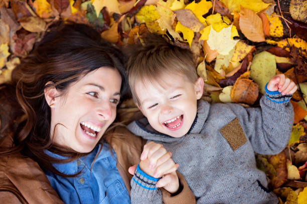 istock Mother with son in forest in autumn 854528984
